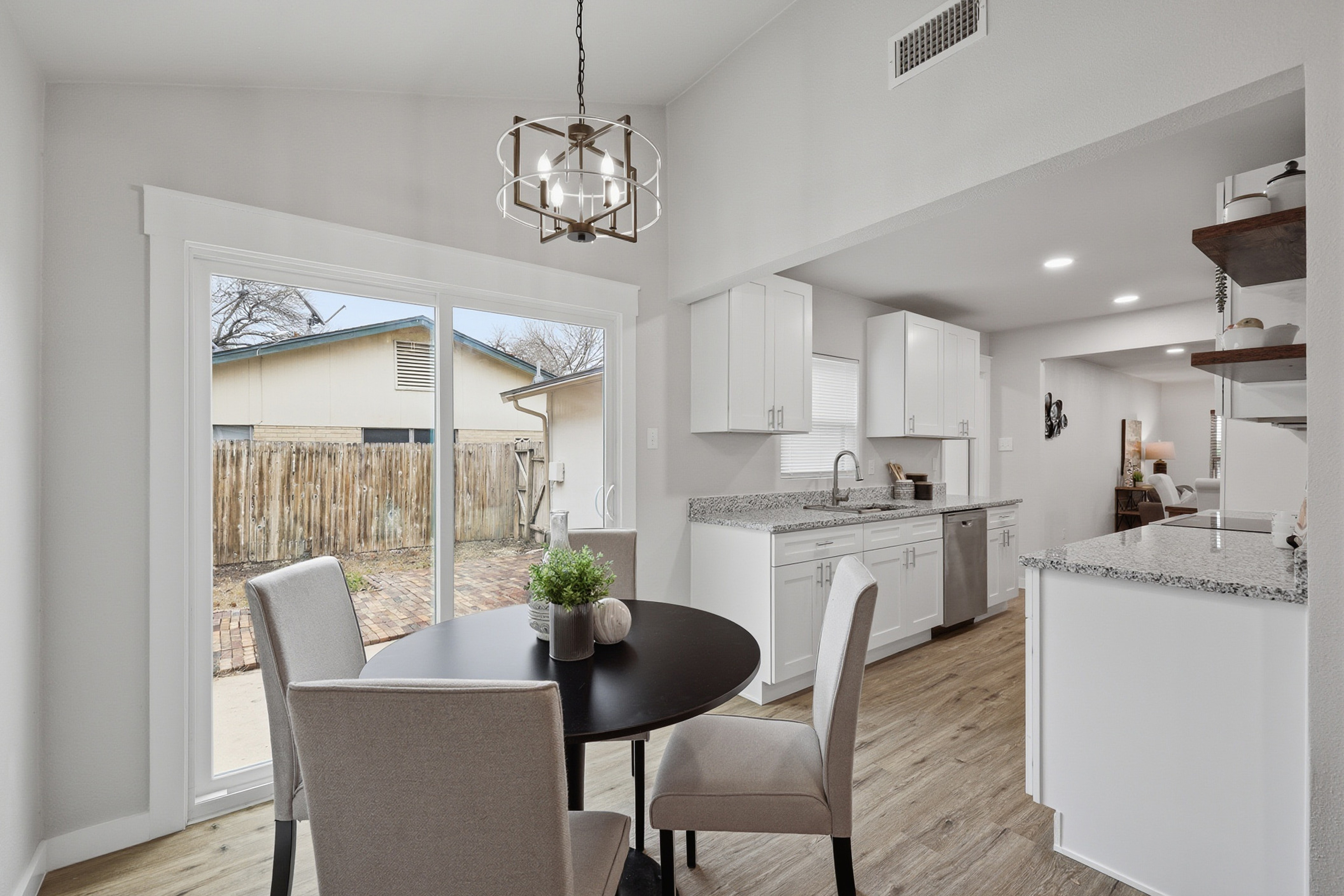 Breakfast nook and kitchen with natural light and sliding patio door
